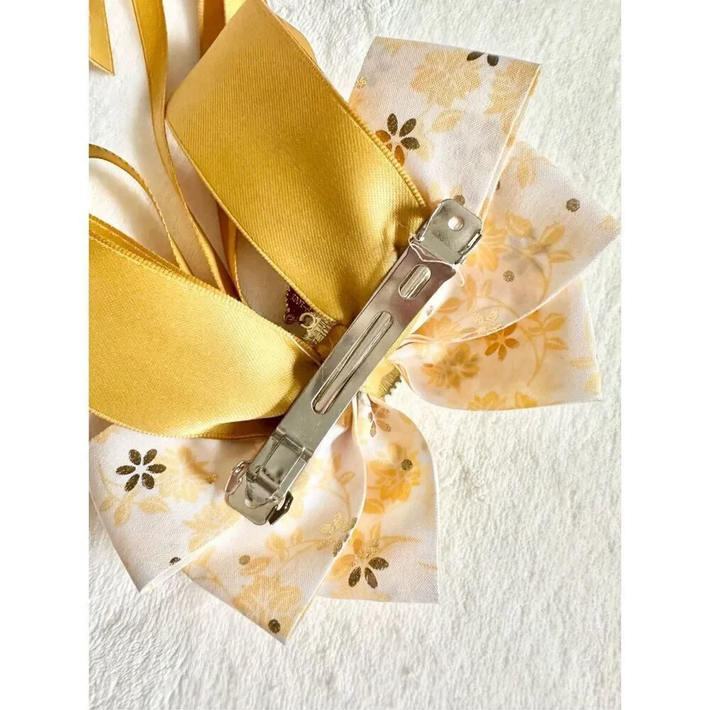 Adorable floral yellow hair bow with floral and pearl accents with hair Barrette